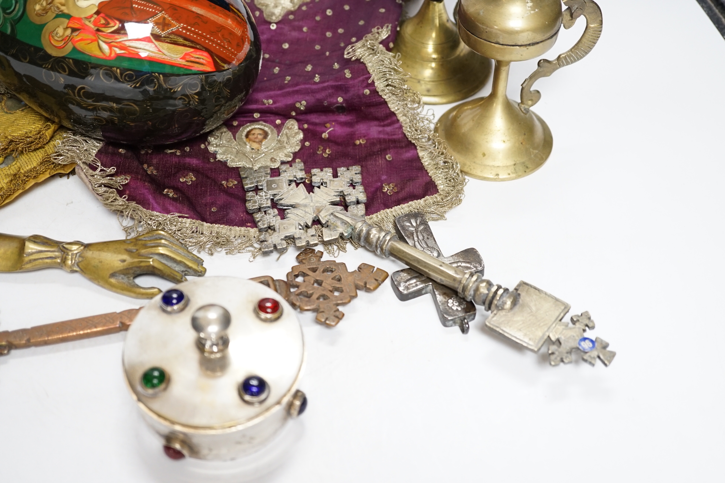 Coptic Christian items including crosses, censers, a brass angel, two embroidered chalice covers, a large painted egg with orthodox cross on the top, a lidded patten box, etc. (11)